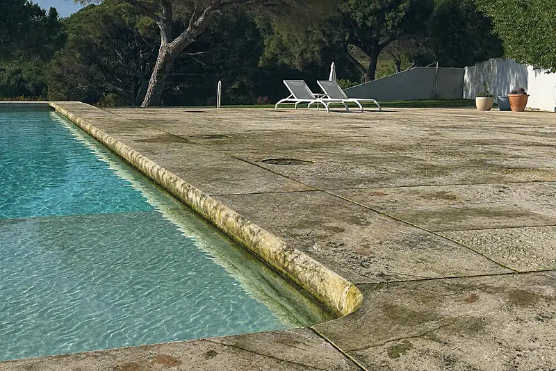 Illustration: before, the same limestone pool deck with algae, moss and black spots